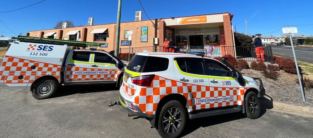 SES vehicles parked outside Deepwater Foodworks, with SES members in the background